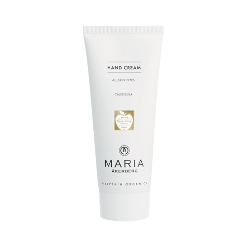 Maria Åkerberg Hand Cream 100 ml. En vit tub med texten 'Hand Cream' överst följt av 'All Skin Types' och 'Calendula'. Under detta finns en guldfärgad etikett med texten 'Winner Organic Beauty Awards 2021'. Längst ner står 'Maria Åkerberg Deepskin Organics'.