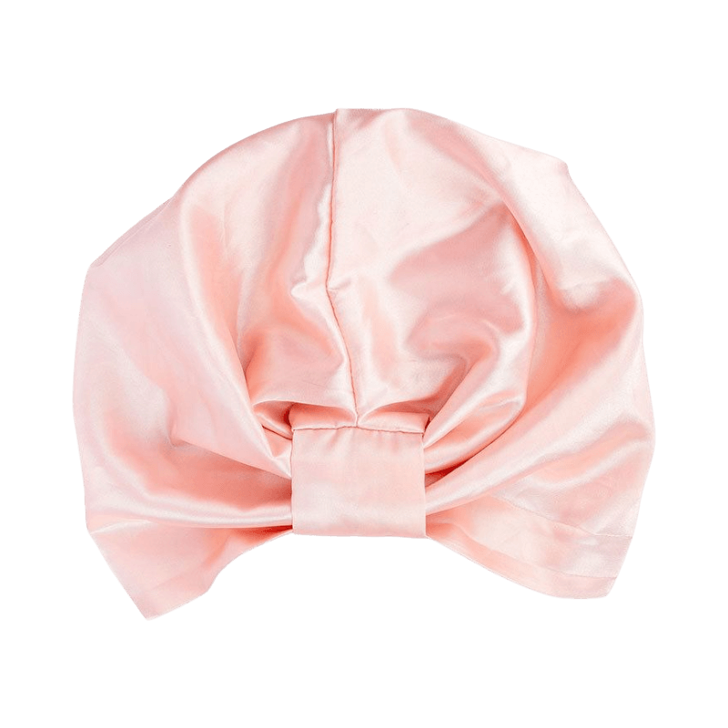 Rosa satin turban för natten med frontknut som skyddar håret och minskar friktion under sömn.