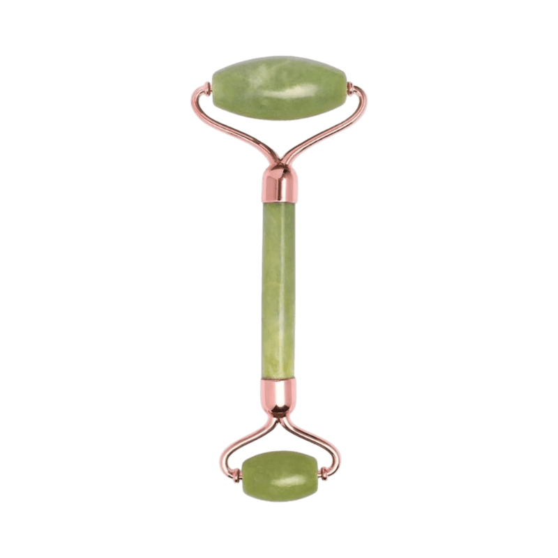 Jade roller med roséfärgade detaljer för uppfriskande ansiktsbehandling.