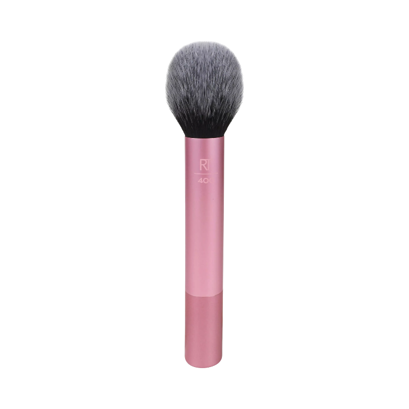 Rund rougeborste från Real Techniques med rosa handtag och fluffig borst för mjuk finish.