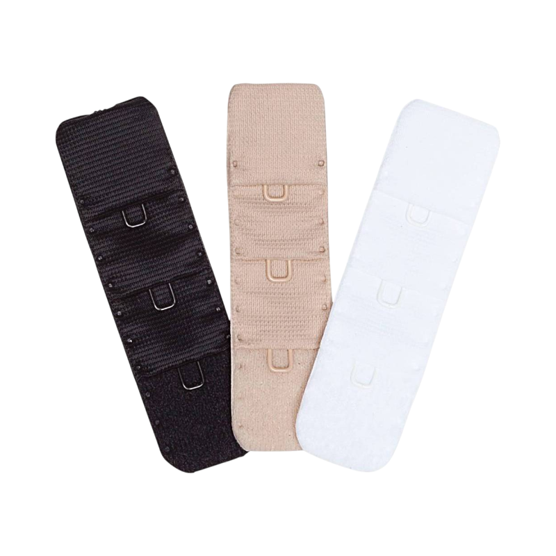 Tre BH-förlängare i vitt, beige och svart med tre rader hyskor och mjuk stretch