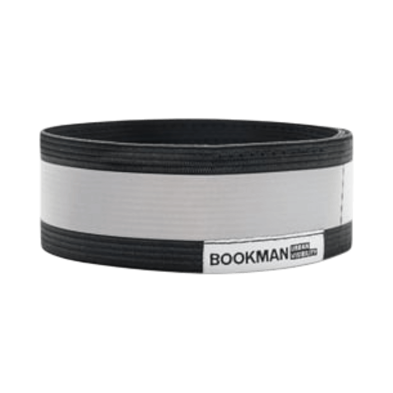 Reflexband från Bookman i svart och silver med kardborre, designat för ökad synlighet i stadsmiljö.