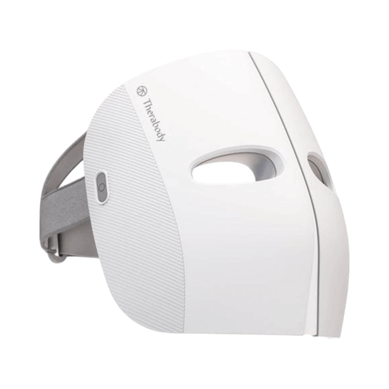 TheraFace LED-mask i vitt med justerbart band för avancerad ansiktsbehandling